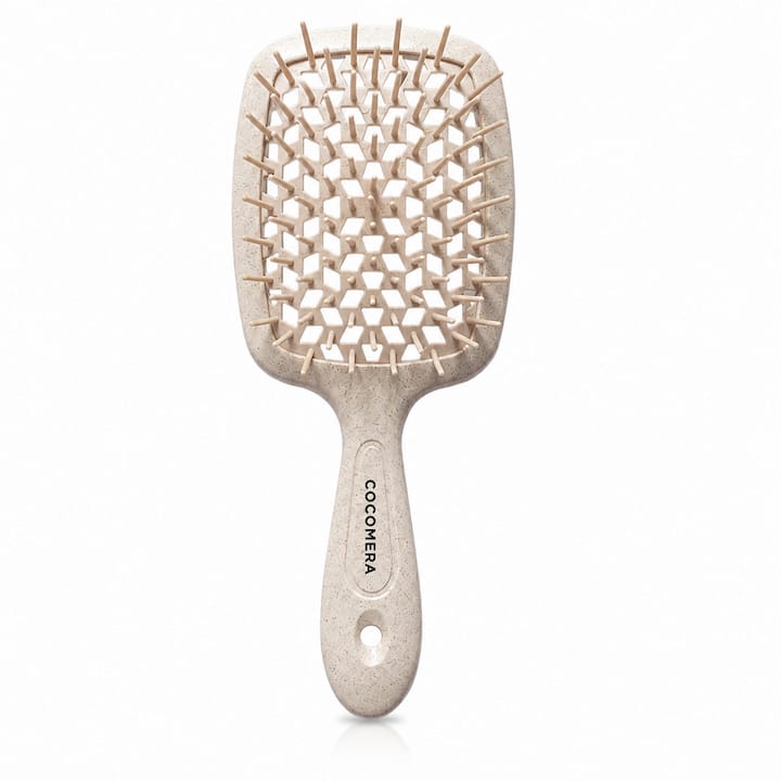Woman detangling curly hair in bathroom
