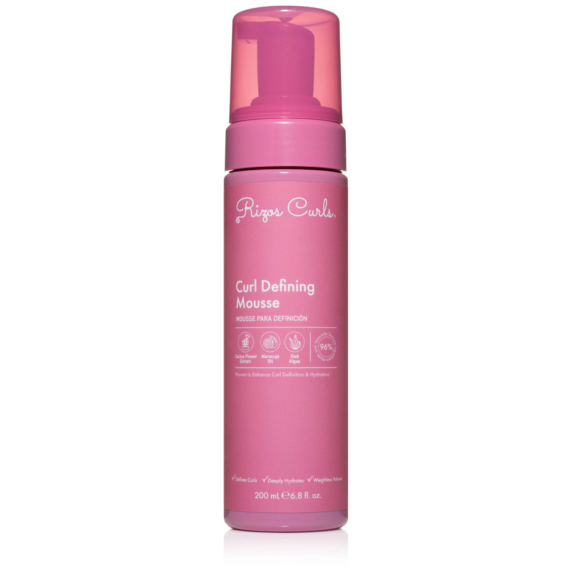 Pink bottle of Rizos Curls Curl Defining Mousse on a white background