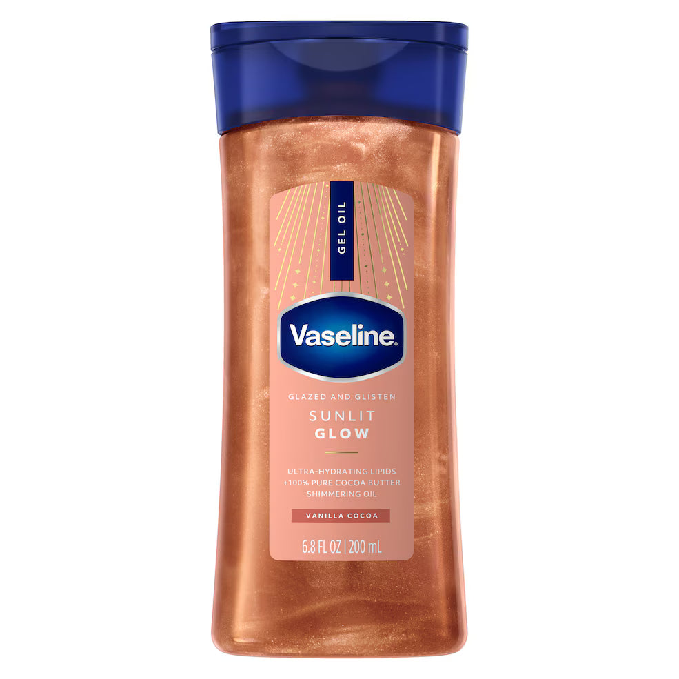 Vaseline Sunlit Glow body oil bottle on a white background